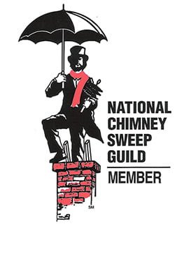 chimney sweep holding an umbrella standing on a chimney