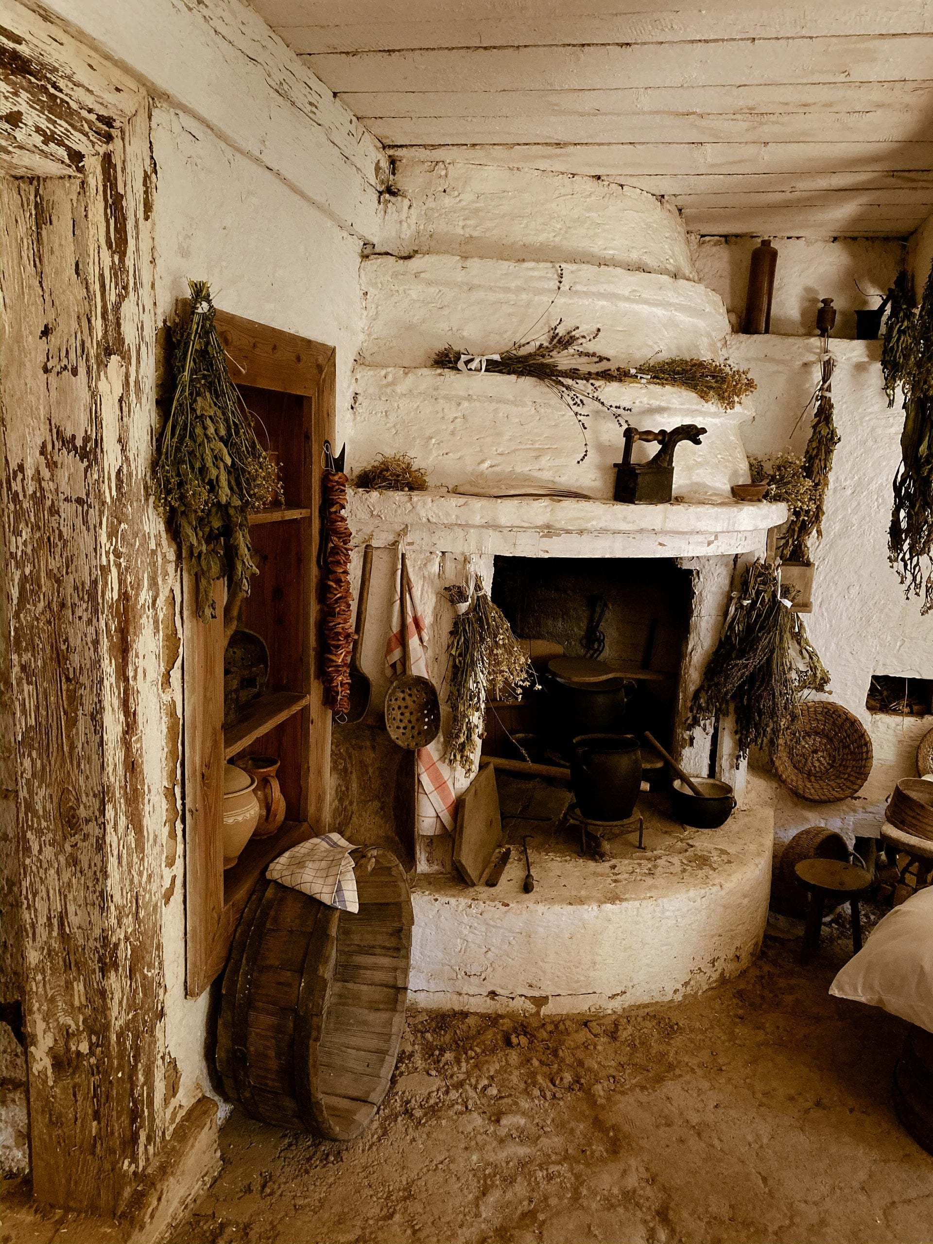 A picture of a chimney in the corner of a room