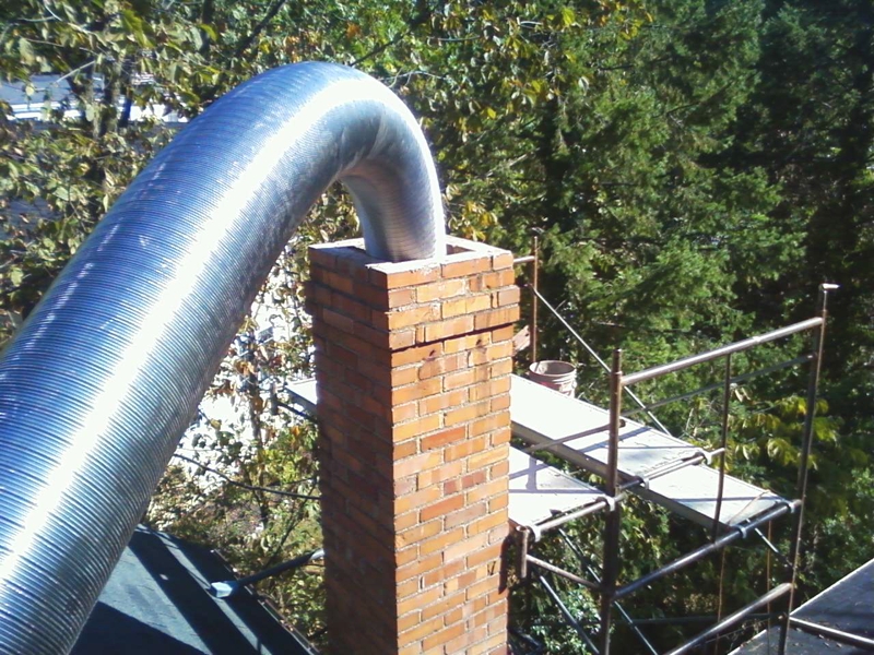 roof in the forest with a smoking chimney
